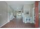 Entry hallway with brick flooring, neutral paint, and view to pool area through the sliding glass doors at 500 23Rd Ave. S, North Myrtle Beach, SC 29582