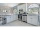Bright kitchen featuring granite countertops, stainless steel appliances, and ample cabinet space at 500 23Rd Ave. S, North Myrtle Beach, SC 29582