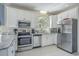 Bright kitchen with stainless steel appliances and ample counter space, ideal for cooking at 500 23Rd Ave. S, North Myrtle Beach, SC 29582