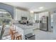 Beautiful kitchen with stainless steel appliances, granite countertops, and a cozy breakfast bar at 500 23Rd Ave. S, North Myrtle Beach, SC 29582