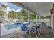 A poolside patio with seating beside the pool and spa in a private backyard at 500 23Rd Ave. S, North Myrtle Beach, SC 29582