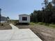 Inviting single-level home with new concrete walkway and plenty of room for parking at 500 King Air Ct, Myrtle Beach, SC 29577
