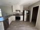 Well-lit kitchen features stainless steel appliances, plenty of cabinets, and durable countertops at 500 King Air Ct, Myrtle Beach, SC 29577
