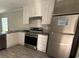 Lovely kitchen with stainless steel appliances, gray countertops, and light wood-colored cabinets at 500 King Air Ct, Myrtle Beach, SC 29577