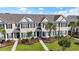 Charming townhome complex featuring manicured lawns, lush landscaping, and inviting walkways at 636 Pistoia Ln. # 636, Myrtle Beach, SC 29579