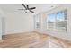 Bright bedroom with neutral walls, hardwood floors, ceiling fan, and large windows at 636 Pistoia Ln. # 636, Myrtle Beach, SC 29579