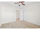 This bedroom includes a ceiling fan, a closet, and an open door to the connected bathroom at 636 Pistoia Ln. # 636, Myrtle Beach, SC 29579