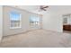 This spacious bedroom features carpet floors, large windows and a ceiling fan at 636 Pistoia Ln. # 636, Myrtle Beach, SC 29579