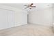 This bright bedroom features carpeted floors, a ceiling fan and a spacious closet at 636 Pistoia Ln. # 636, Myrtle Beach, SC 29579