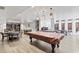 Spacious game room features a pool table, ample seating, warm lighting and plenty of room for entertainment at 636 Pistoia Ln. # 636, Myrtle Beach, SC 29579