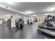 Bright gym features modern exercise equipment including treadmills, stationary bikes and weight machines on a sleek black floor at 636 Pistoia Ln. # 636, Myrtle Beach, SC 29579