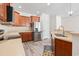 Updated kitchen features stainless steel appliances, wooden cabinets, and hardwood floors at 636 Pistoia Ln. # 636, Myrtle Beach, SC 29579