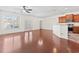 Open-concept living room with hardwood floors, natural light, and an adjacent kitchen area at 636 Pistoia Ln. # 636, Myrtle Beach, SC 29579