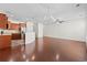 Open-concept layout with hardwood floors connecting living room, kitchen, and staircase at 636 Pistoia Ln. # 636, Myrtle Beach, SC 29579