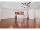 Spacious open-concept living area with hardwood floors, neutral walls, and an adjacent kitchen at 636 Pistoia Ln. # 636, Myrtle Beach, SC 29579