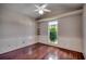 Cozy bedroom features wood-look floors, chair railing and bright window overlooking backyard at 638 Hatteras River Rd., Myrtle Beach, SC 29588