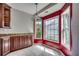 Cozy breakfast nook featuring built-in cabinets, tile floors and bright sunny windows at 638 Hatteras River Rd., Myrtle Beach, SC 29588
