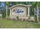 Stone entrance sign for 'The Lakes' community, complemented with a flower bed at 638 Hatteras River Rd., Myrtle Beach, SC 29588