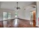 Bright living room featuring hardwood floors, a vaulted ceiling, and access to the backyard at 638 Hatteras River Rd., Myrtle Beach, SC 29588