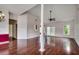 Open living room featuring vaulted ceilings, hardwood floors, and natural light at 638 Hatteras River Rd., Myrtle Beach, SC 29588