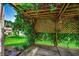 Back patio features a pergola covered with vines, offering a cool and shady outdoor space at 638 Hatteras River Rd., Myrtle Beach, SC 29588