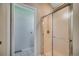 Bathroom features a shower with sliding glass door and white tile flooring at 638 Hatteras River Rd., Myrtle Beach, SC 29588