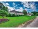 Spacious side yard offers lush green grass and landscaped gardens for outdoor enjoyment at 638 Hatteras River Rd., Myrtle Beach, SC 29588