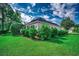 Well-maintained side yard with green grass, landscaped beds, and neighborhood views at 638 Hatteras River Rd., Myrtle Beach, SC 29588