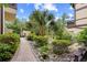 Picturesque landscaping features a stone and pebble path with beautiful green foliage at 6813 Porcher Dr. # 21, Myrtle Beach, SC 29572