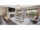 This cozy living room features a fireplace, a large sectional sofa and sliding doors to a private balcony at 6813 Porcher Dr. # 21, Myrtle Beach, SC 29572