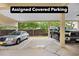Assigned covered parking featuring a silver sedan and a black truck at 6813 Porcher Dr. # 21, Myrtle Beach, SC 29572