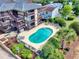 Community kidney-shaped pool with lounge chairs at 6813 Porcher Dr. # 21, Myrtle Beach, SC 29572