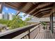 Exterior view of a condo balcony offering views of lush greenery and other buildings in the surrounding area at 6813 Porcher Dr. # 21, Myrtle Beach, SC 29572