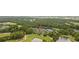 Aerial view of waterfront condos surrounded by mature trees and a golf course at 69 Pinehurst Ln. # 3-F, Pawleys Island, SC 29585