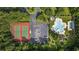 Aerial view of the pool, parking, and tennis courts of a community at 69 Pinehurst Ln. # 3-F, Pawleys Island, SC 29585