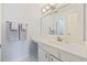 Bathroom boasts a single sink vanity, bright lighting, and pristine white cabinets at 69 Pinehurst Ln. # 3-F, Pawleys Island, SC 29585