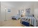 Charming bedroom with two twin beds, nautical decor, and wood floors at 69 Pinehurst Ln. # 3-F, Pawleys Island, SC 29585