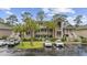 Coastal condominium exterior showcasing multiple levels with parking, landscaping, and stairway access at 69 Pinehurst Ln. # 3-F, Pawleys Island, SC 29585