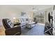 Bright living room with a ceiling fan, an accent rug, comfortable seating and exterior access at 69 Pinehurst Ln. # 3-F, Pawleys Island, SC 29585