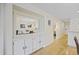Open concept dining and living area with hardwood floors, white walls and views of kitchen at 69 Pinehurst Ln. # 3-F, Pawleys Island, SC 29585