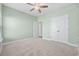 Comfortable bedroom with ceiling fan, a double closet and easy access to additional rooms at 692 Cherry Blossom Dr., Murrells Inlet, SC 29576