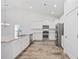 Modern kitchen with stainless steel appliances and bright white cabinets at 692 Cherry Blossom Dr., Murrells Inlet, SC 29576