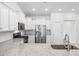 Open kitchen featuring granite counters, stainless steel appliances, and white cabinetry at 692 Cherry Blossom Dr., Murrells Inlet, SC 29576