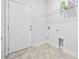 Practical laundry room with ample storage space and washer/dryer hookups at 692 Cherry Blossom Dr., Murrells Inlet, SC 29576
