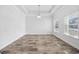 Spacious living room boasts lots of natural light and wood-look flooring at 692 Cherry Blossom Dr., Murrells Inlet, SC 29576
