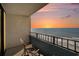 Balcony view overlooking the ocean with amazing sunset views and comfortable seating at 7100 N Ocean Blvd. N # 1011, Myrtle Beach, SC 29572