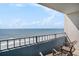 Balcony view overlooking the ocean with a seating area where you can relax and enjoy the view at 7100 N Ocean Blvd. N # 1011, Myrtle Beach, SC 29572
