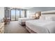 Bright bedroom showcasing balcony access with ocean view, two beds, and a relaxing ambiance at 7100 N Ocean Blvd. N # 1011, Myrtle Beach, SC 29572