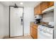 Functional kitchenette with appliances and ample storage, ideal for preparing snacks and light meals at 7100 N Ocean Blvd. N # 1011, Myrtle Beach, SC 29572