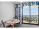 Cozy living area with a dining table and access to a private balcony with ocean views at 7100 N Ocean Blvd. N # 1011, Myrtle Beach, SC 29572